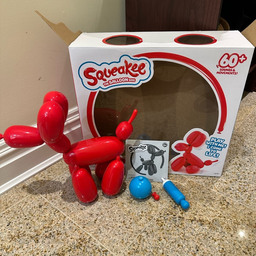 Squeakee the Balloon Dog red brand new with box never used. Includes parts shown